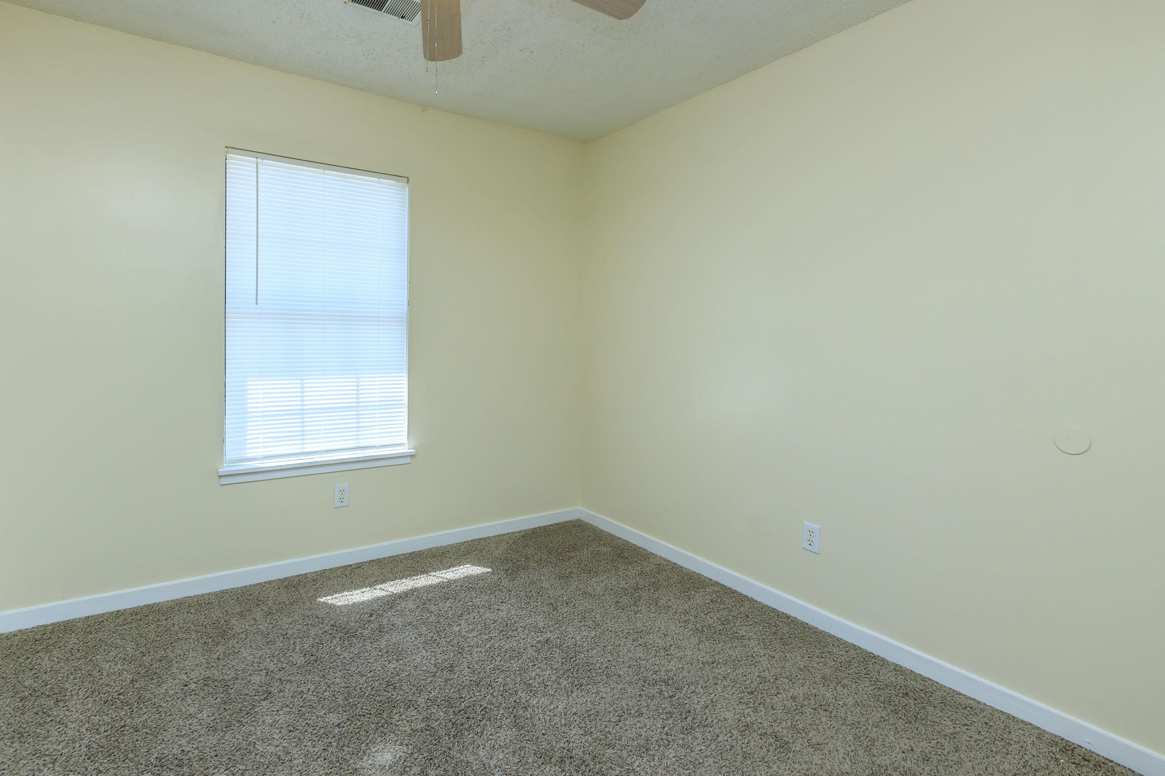 a room with a sink and a window