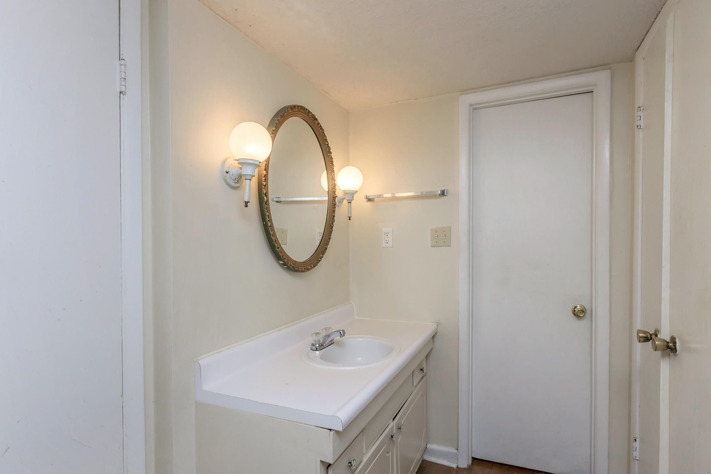 a shower that has a sink and a mirror