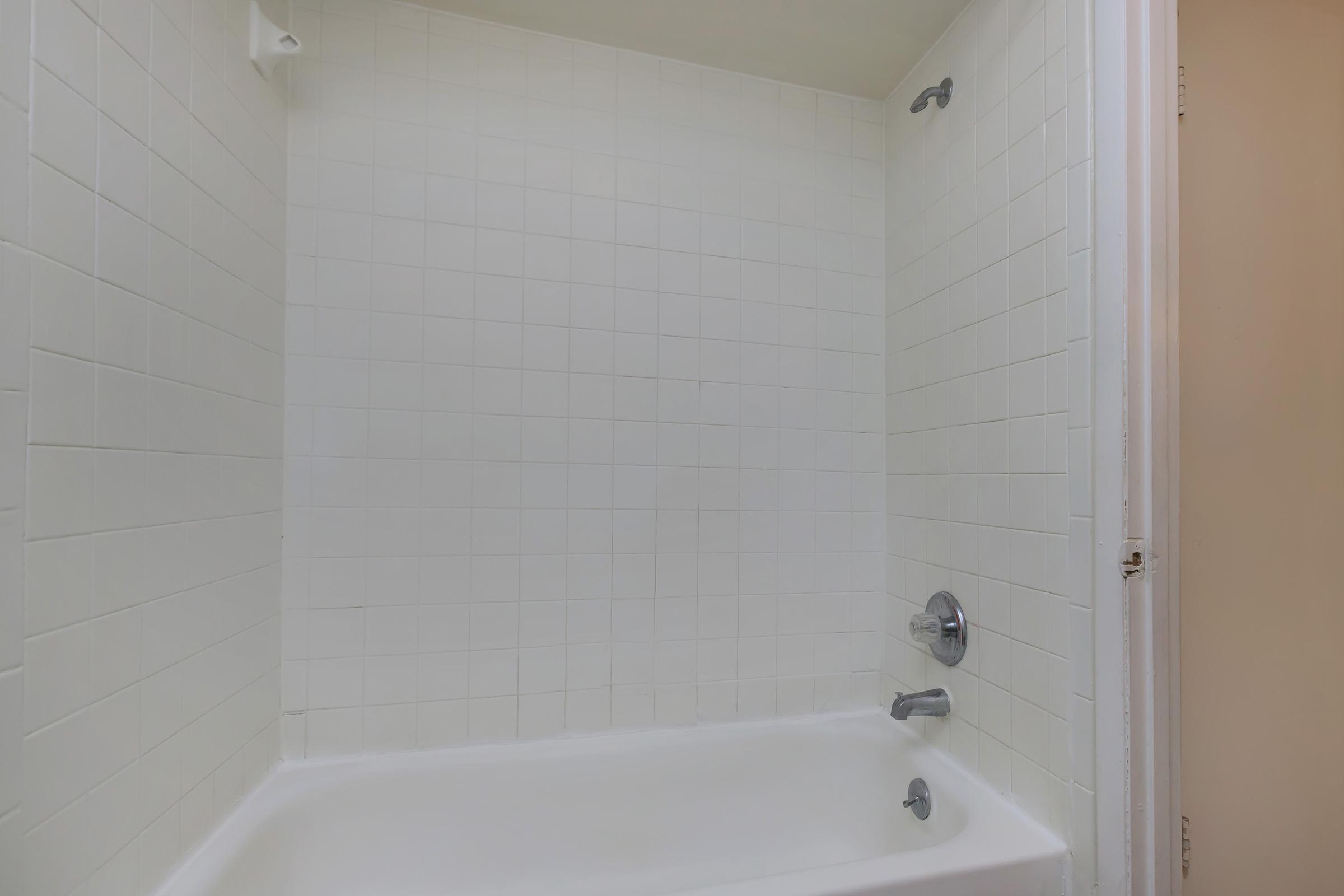 a close up of a sink and a bath tub