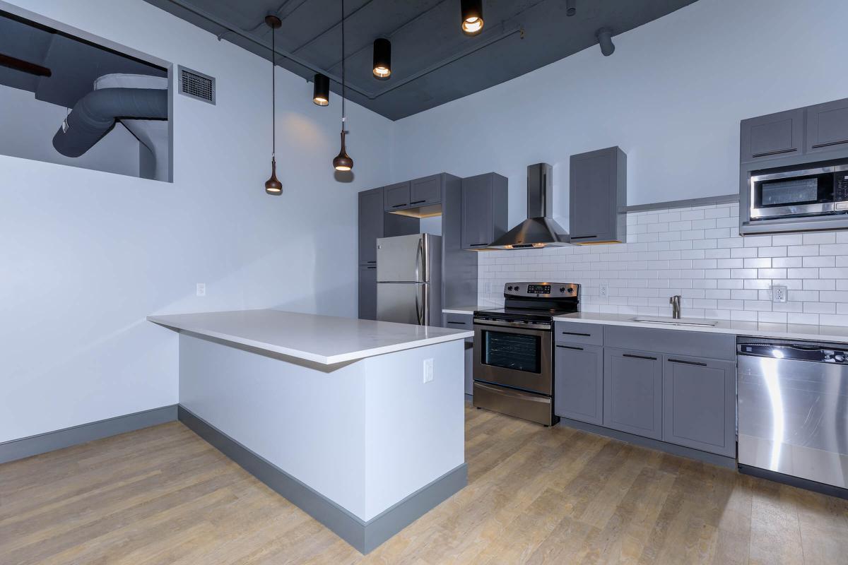 a kitchen with a wood floor