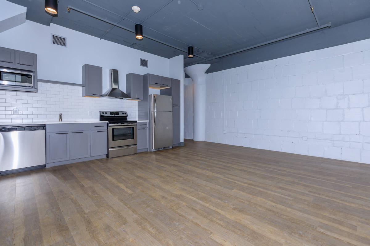 a kitchen with a wood floor