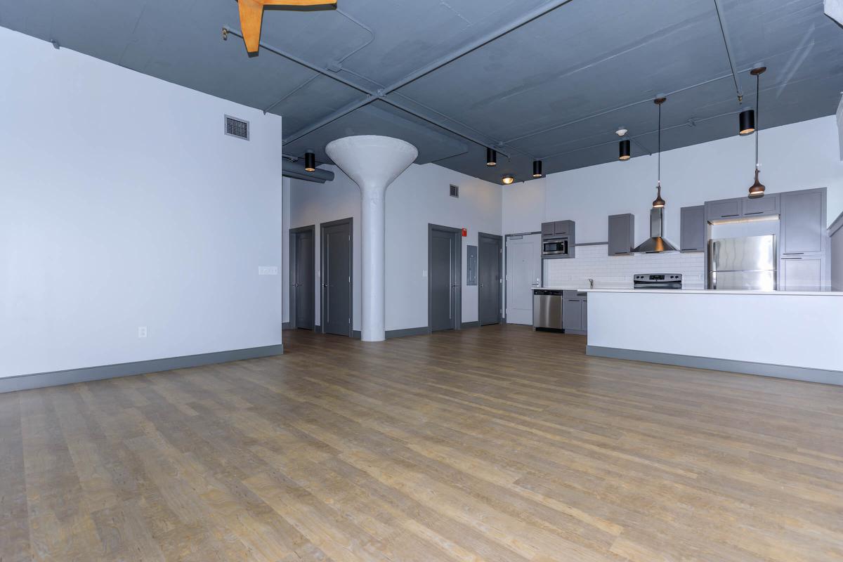 a kitchen with a building in the background