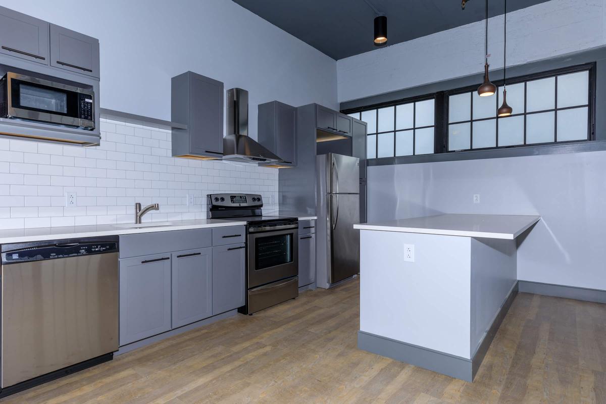 a large kitchen with stainless steel appliances