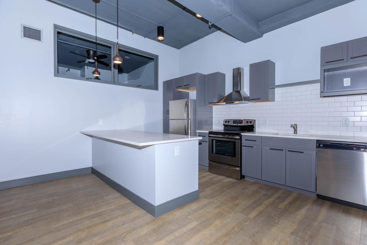 a large kitchen with white cabinets