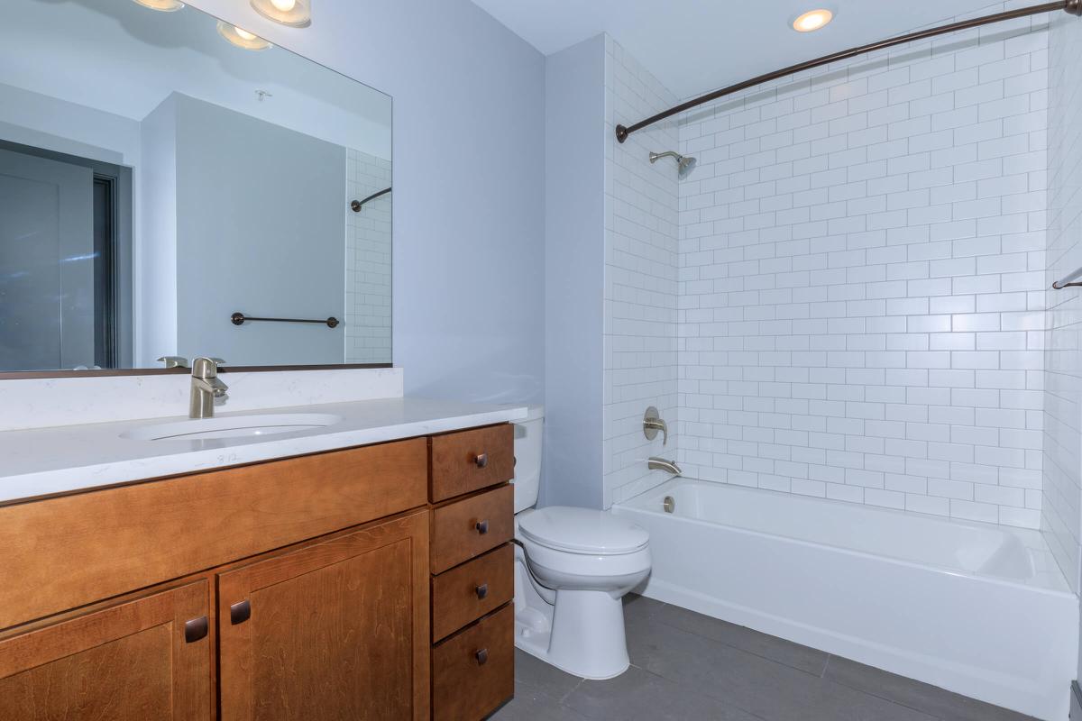 a white sink sitting under a window