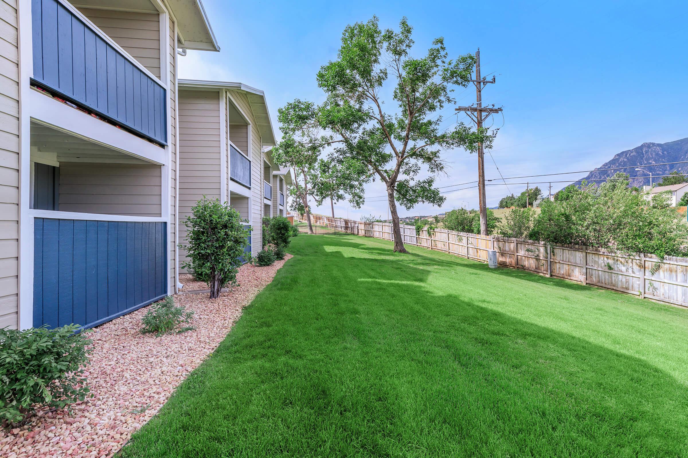 a large lawn in front of a house