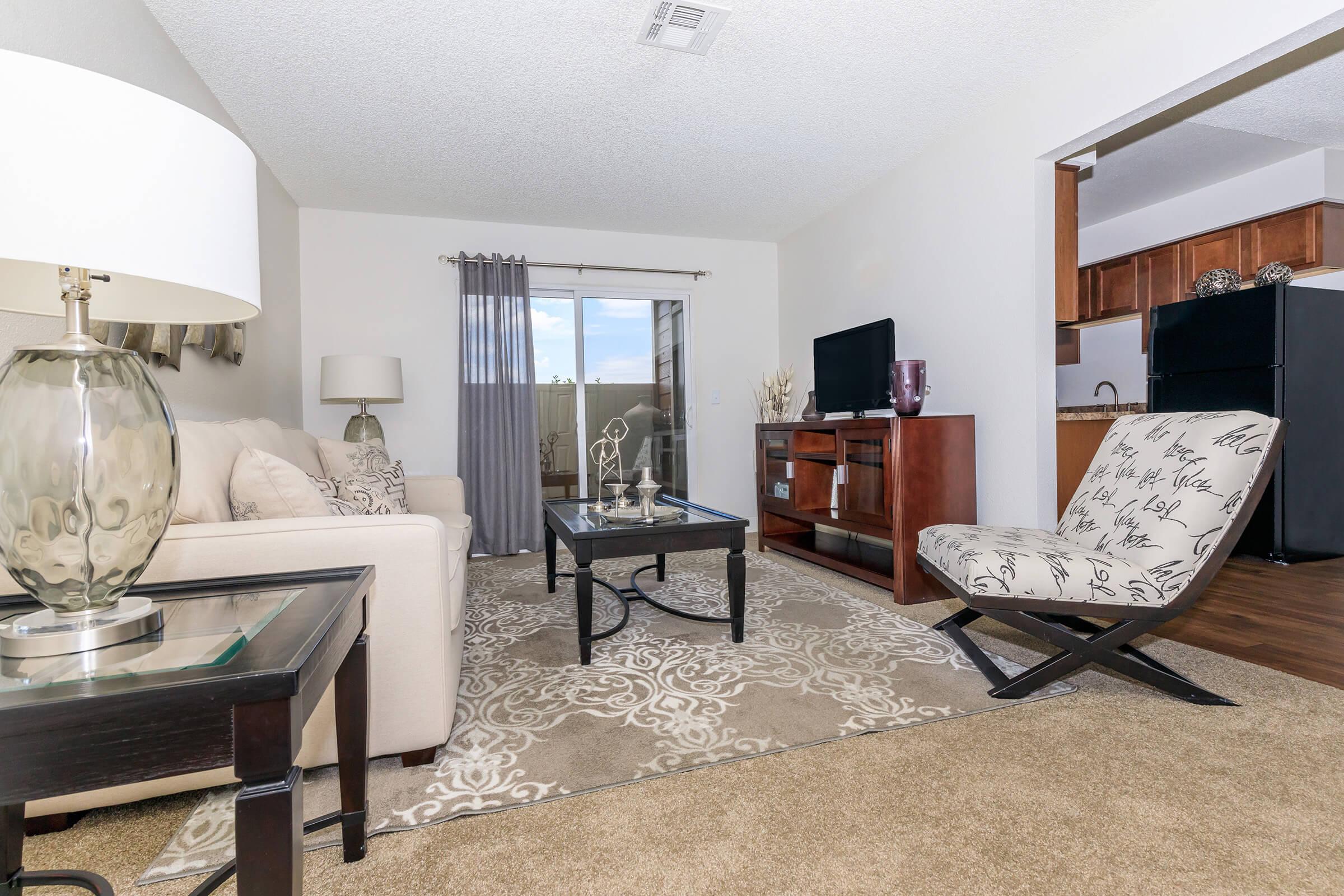 a living room filled with furniture and a table