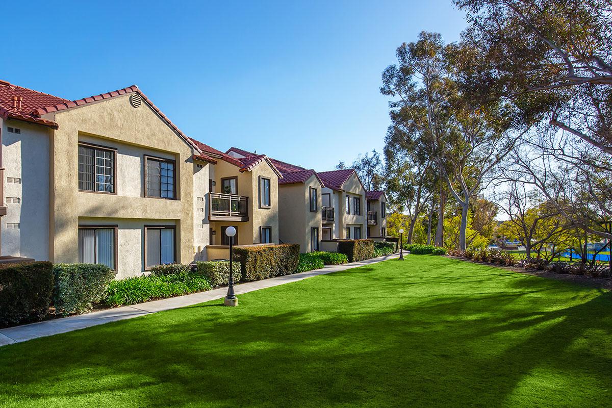 Villa La Paz Apartment Homes community building with green grass