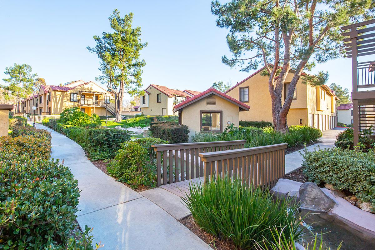 Villa La Paz Apartment Homes community buildings with a bridge