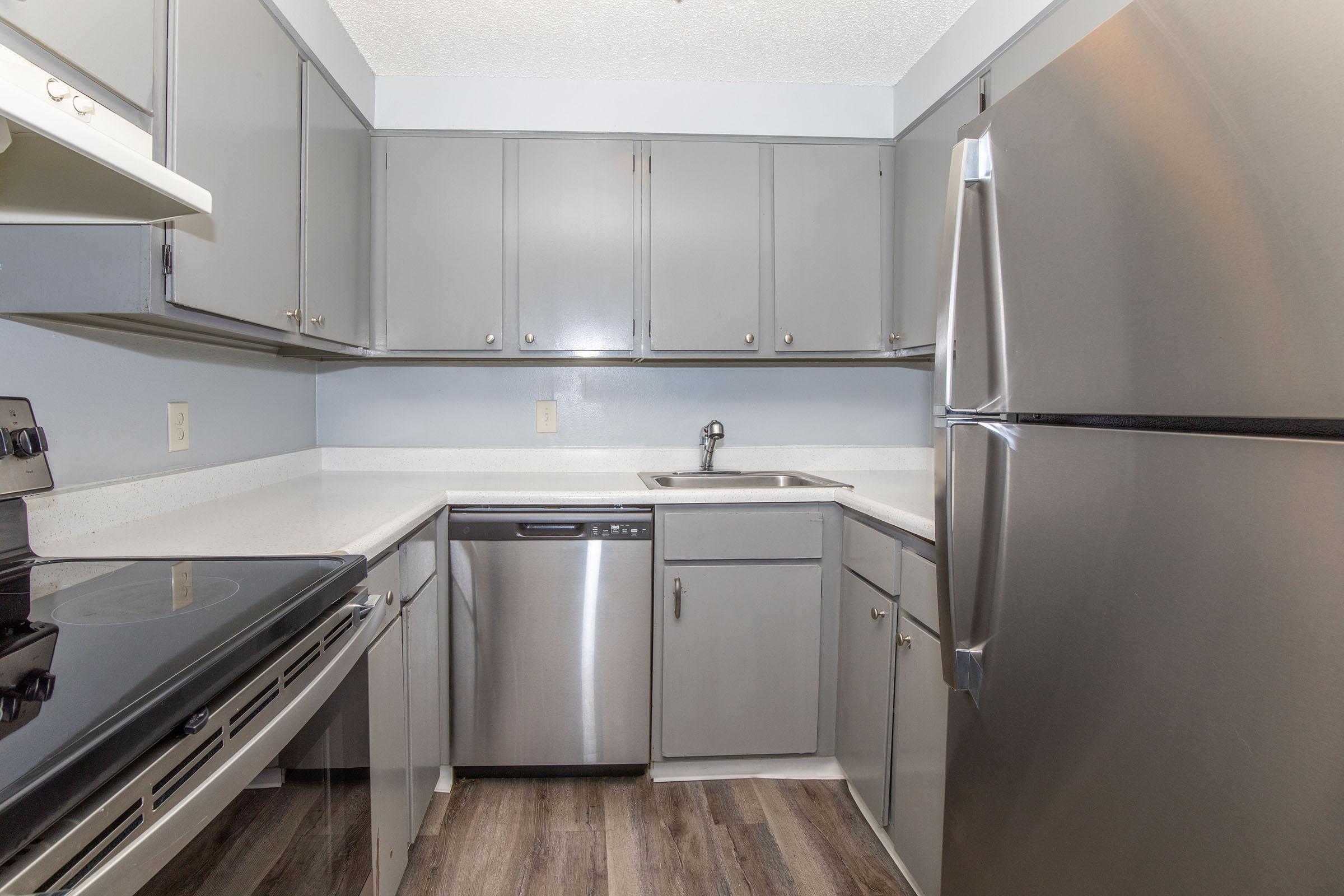 a large kitchen with stainless steel appliances