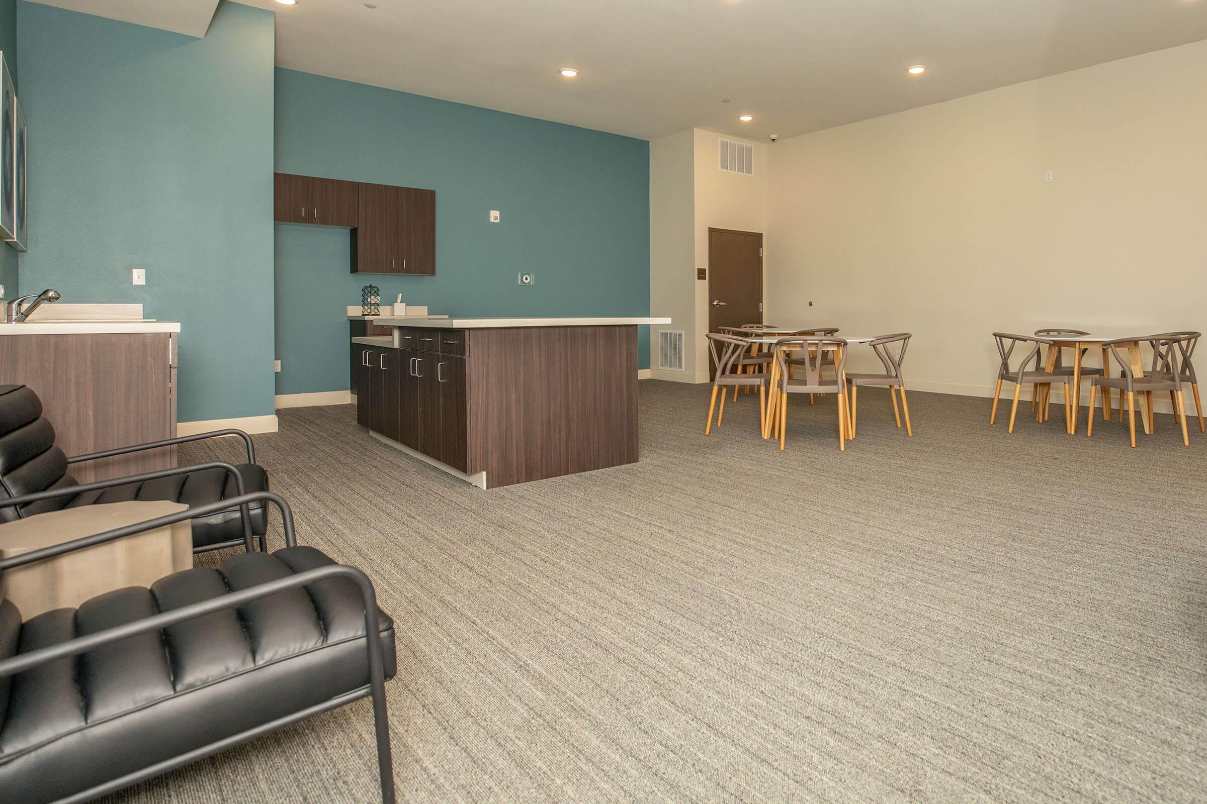 a room filled with furniture on top of a wooden floor