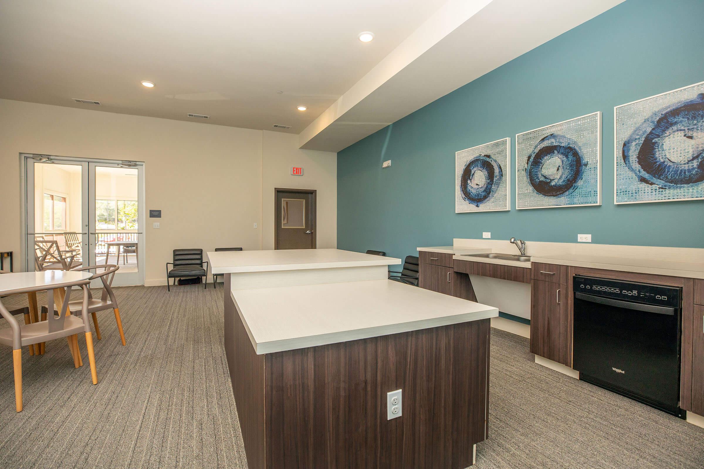 a kitchen with a table in a room