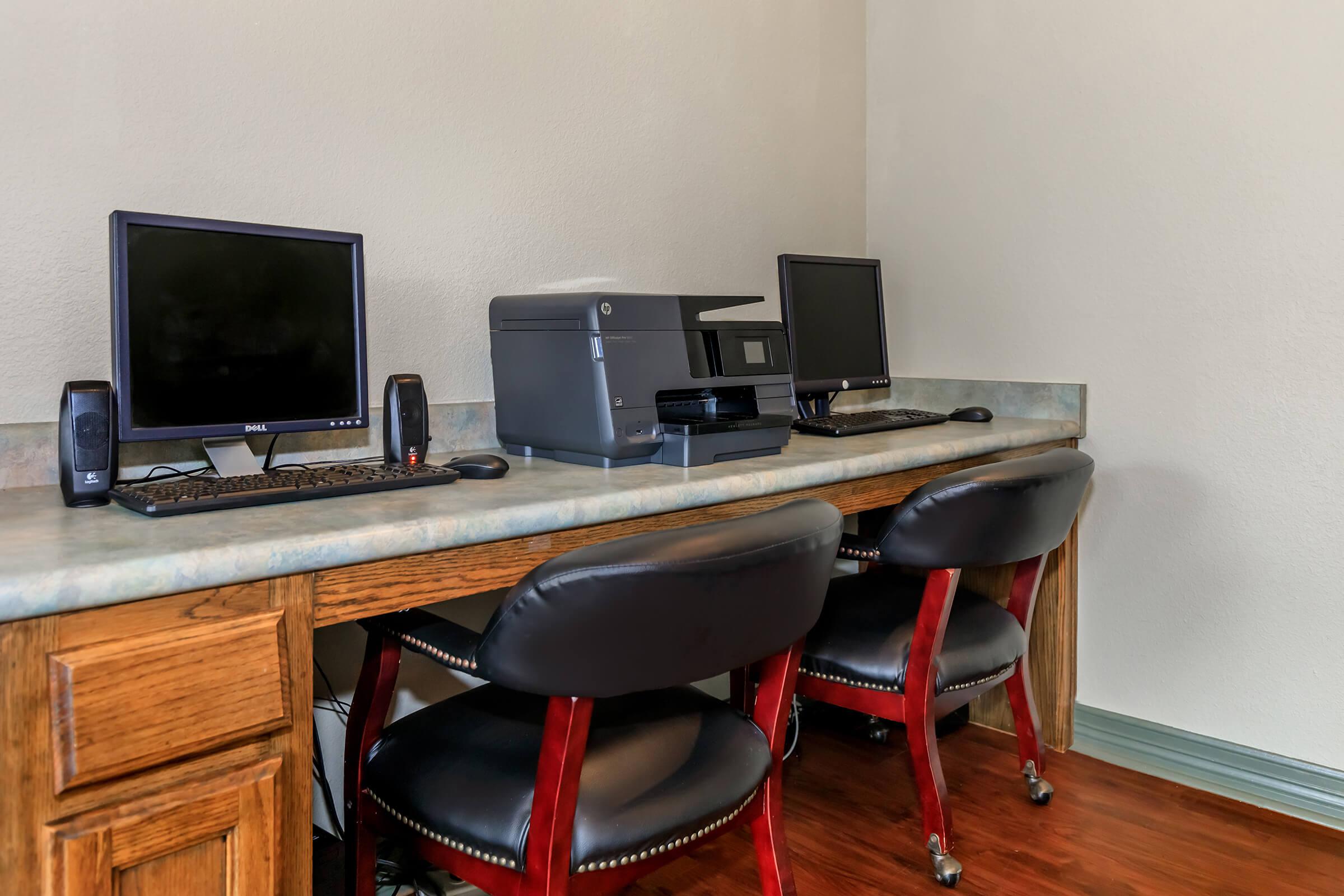 a desktop computer sitting on top of a wooden desk