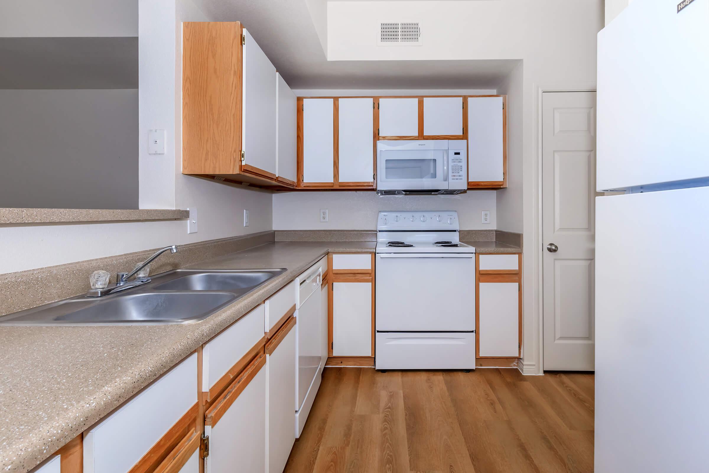 a kitchen with a wood floor