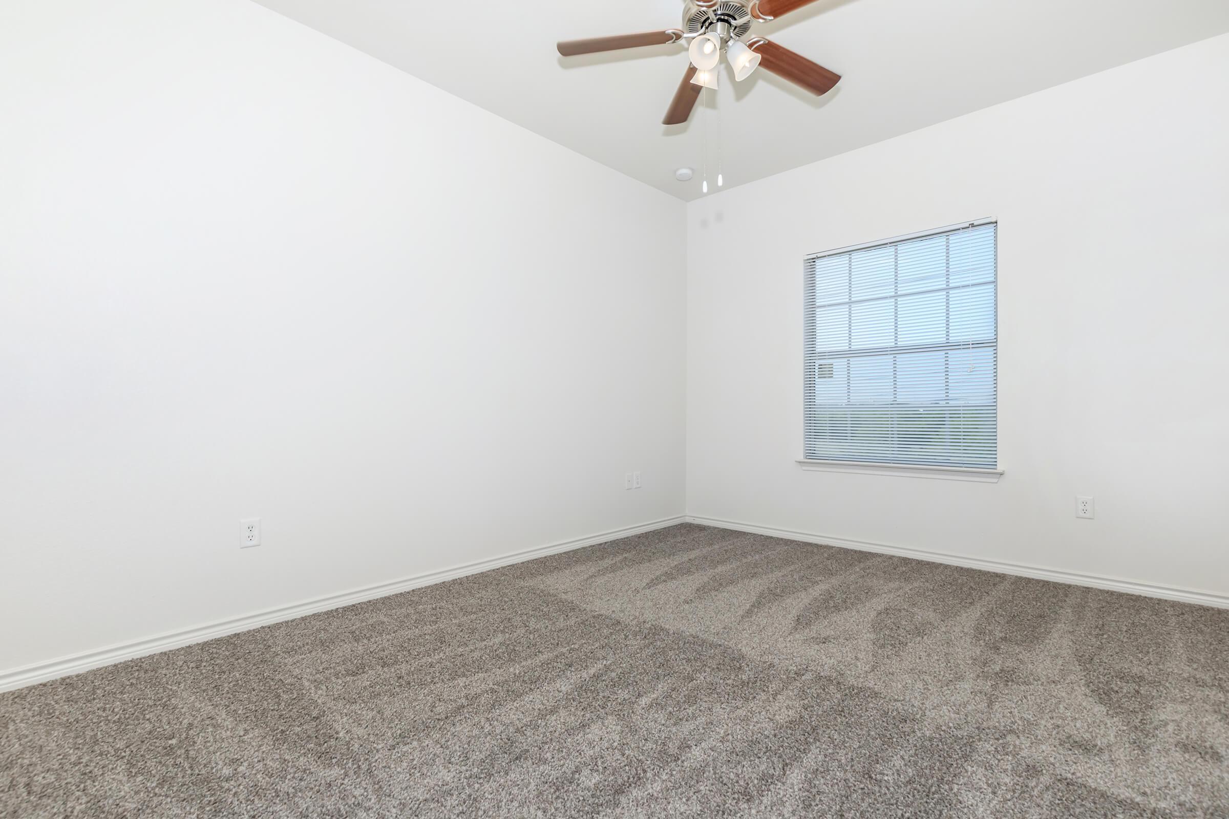 a bedroom with a large window