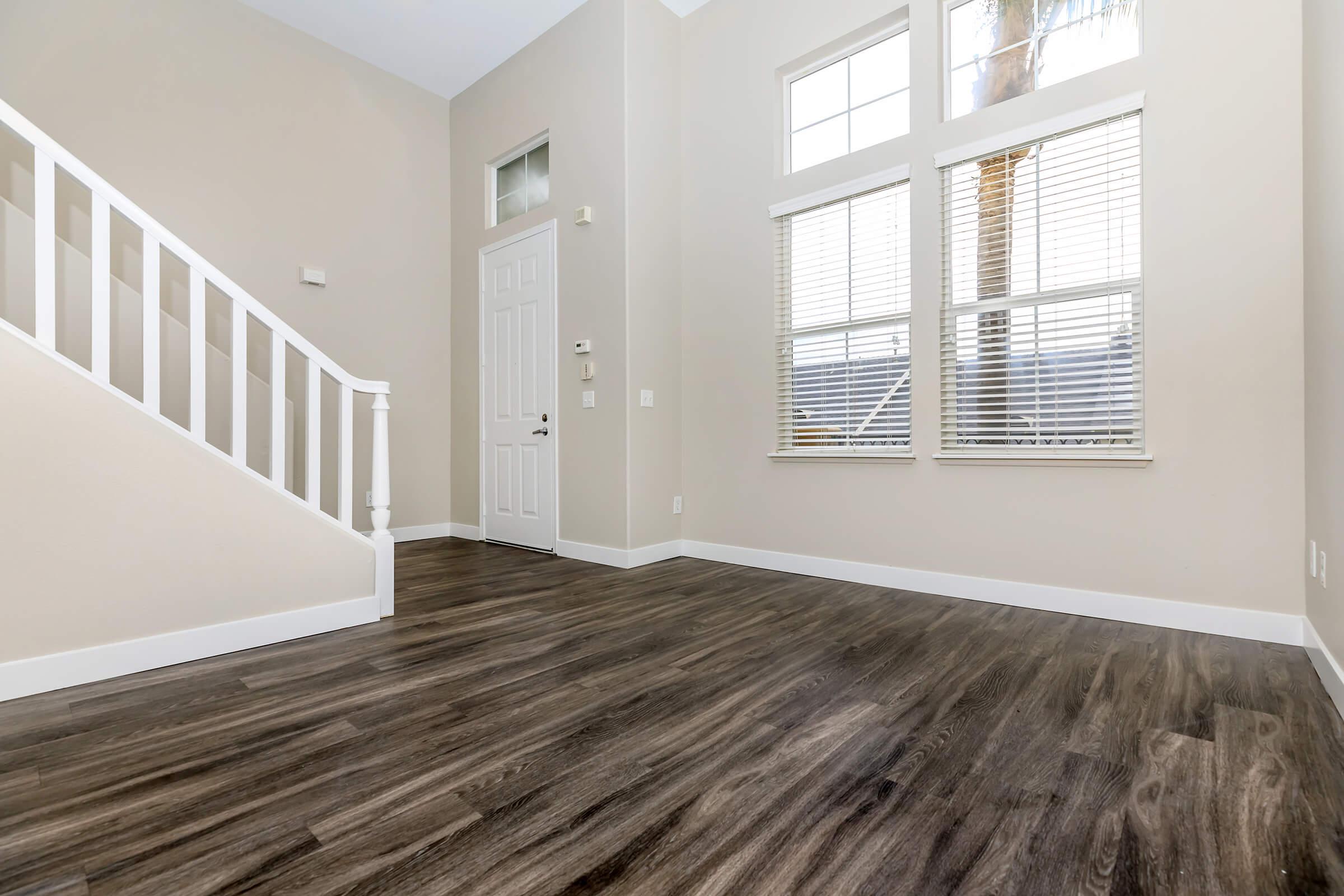 Living room with wooden floors and stairs