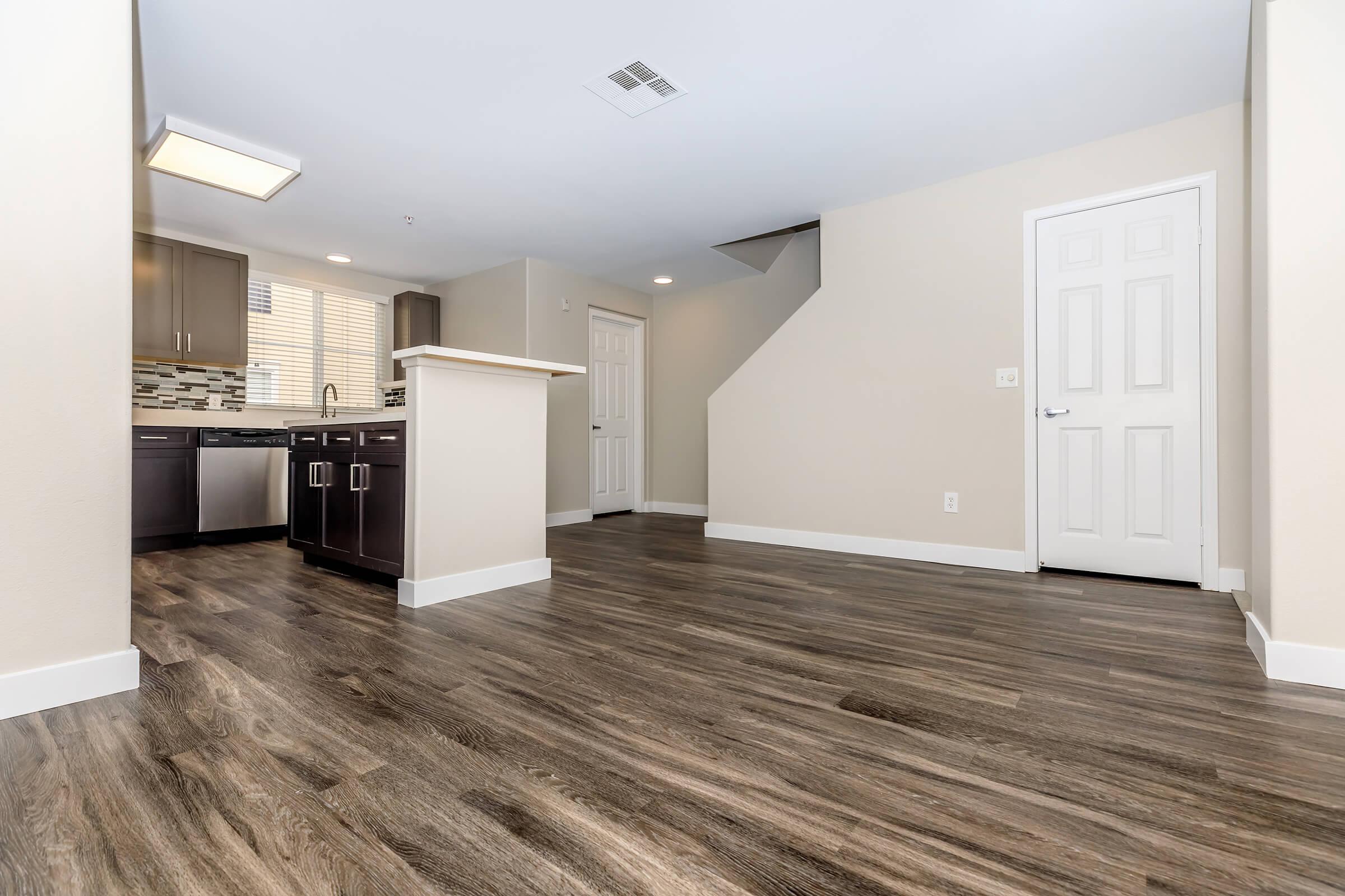 Dining room and kitchen with stairs