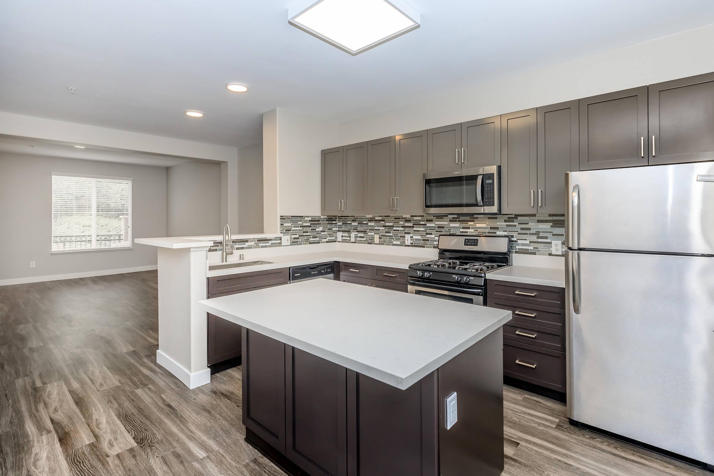 Unfurnished kitchen with an island