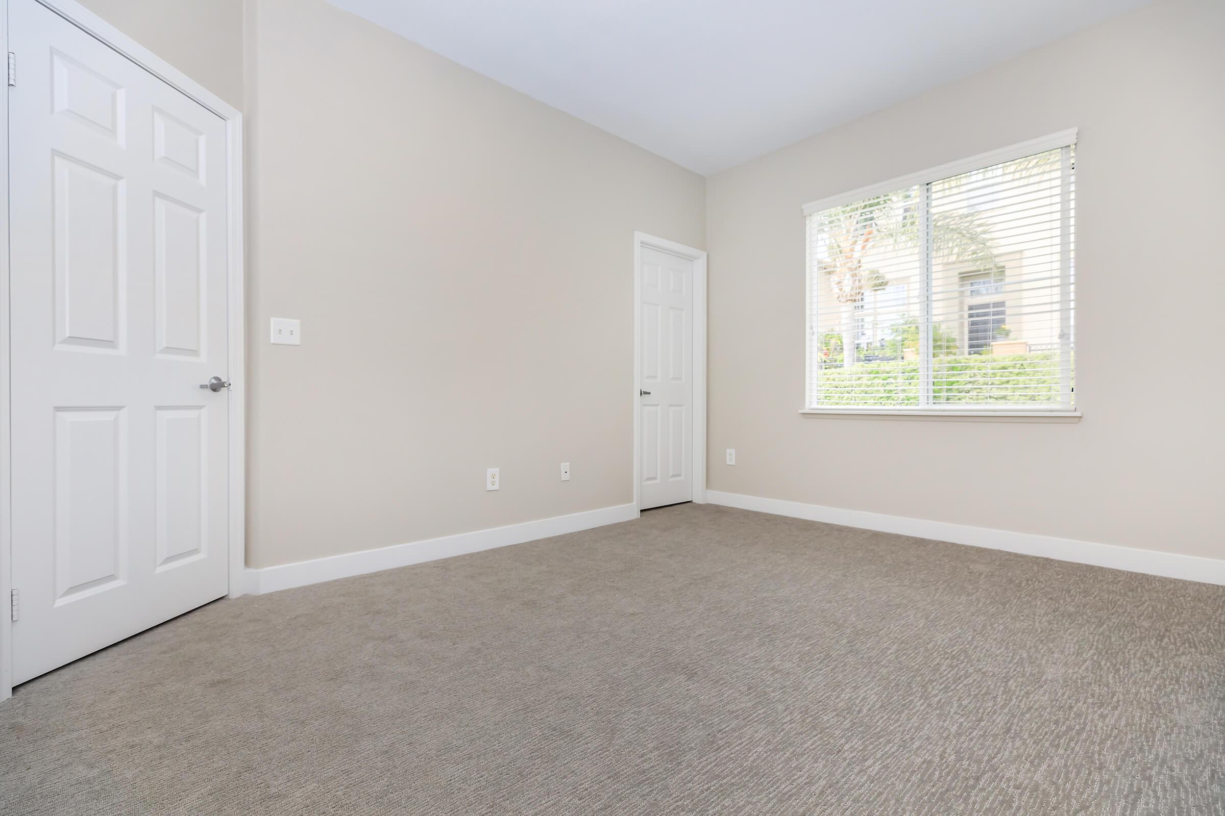 Vacant carpeted bedroom