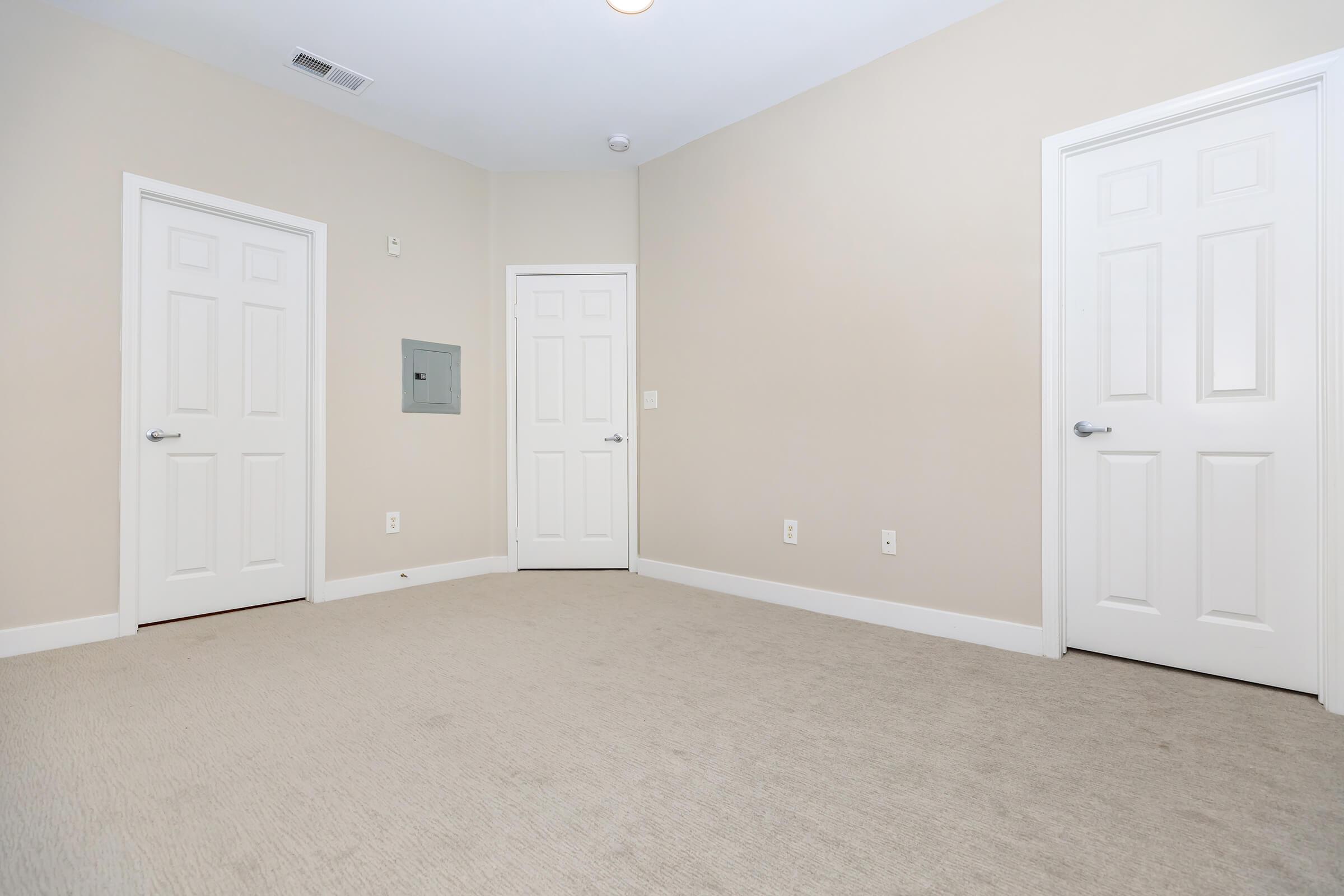 Vacant bedroom with closed doors