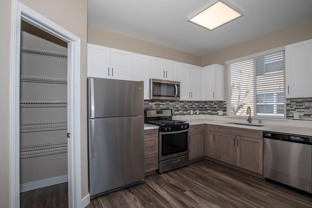 Kitchen with open pantry door