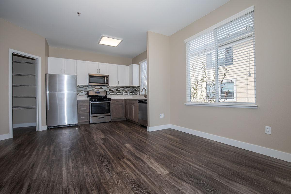 Dining room and kitchen with wooden floors