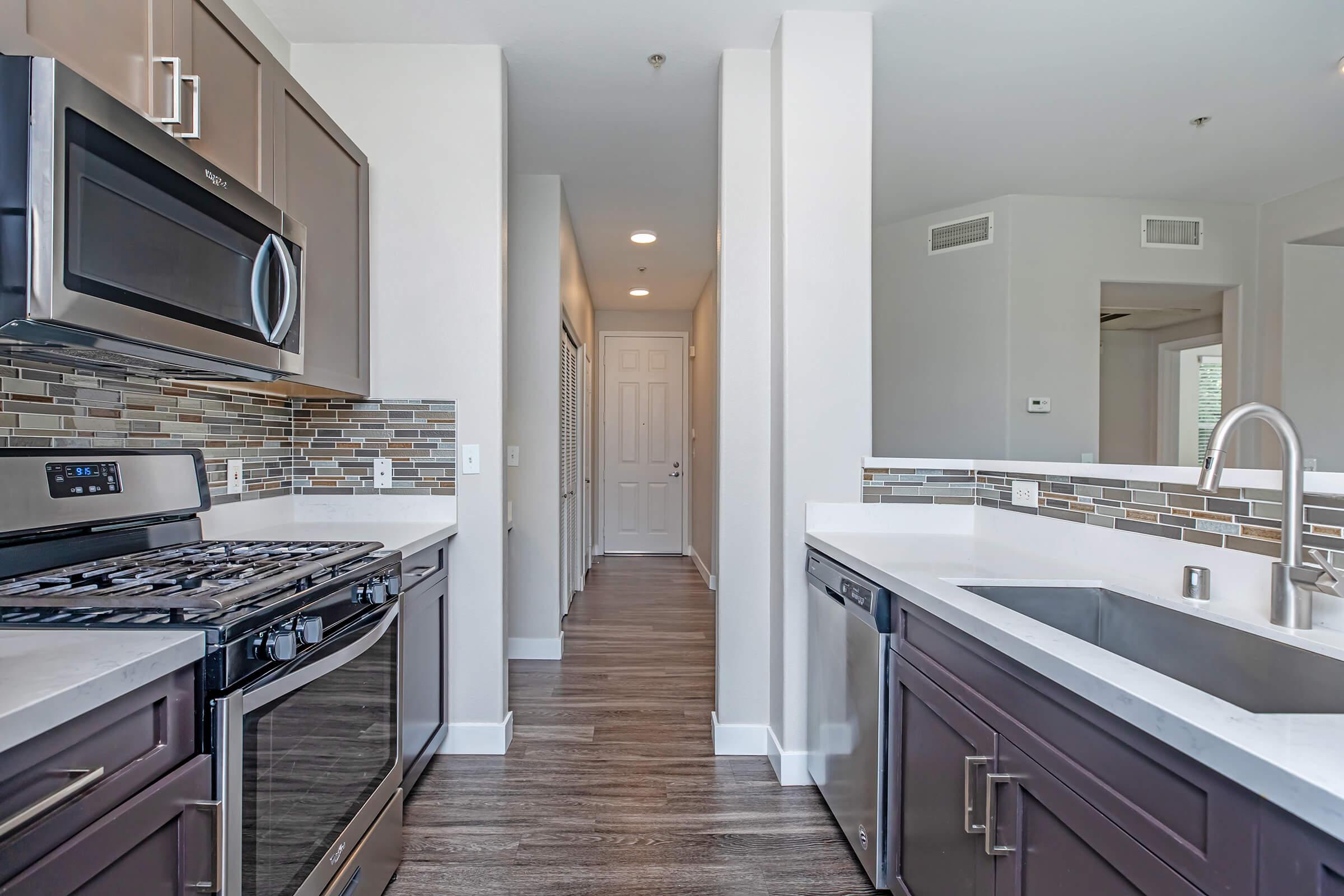 a modern kitchen with stainless steel appliances