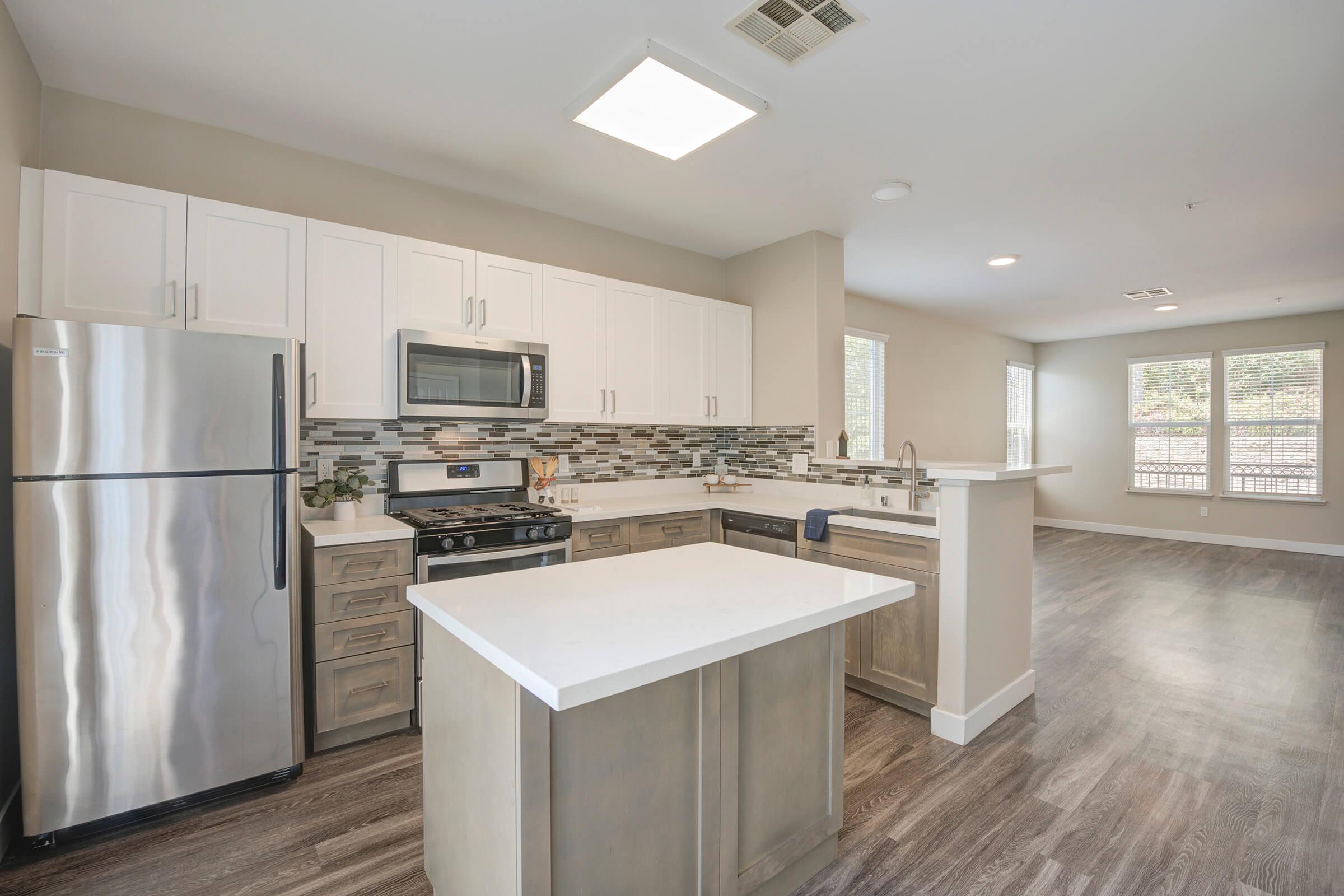 a modern kitchen with stainless steel appliances