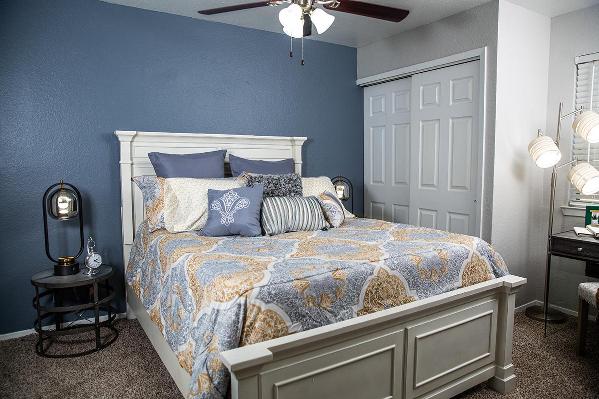 a bedroom with a bed in a room