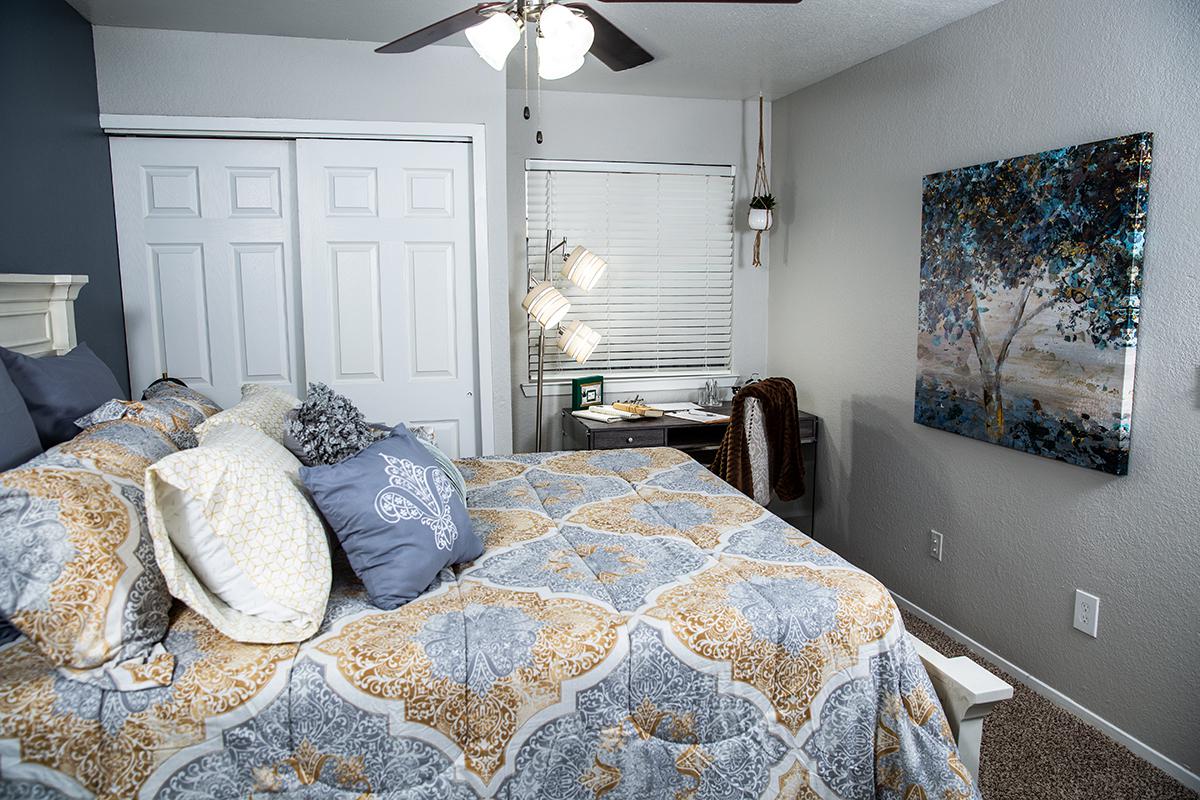 a bedroom with a bed in a room