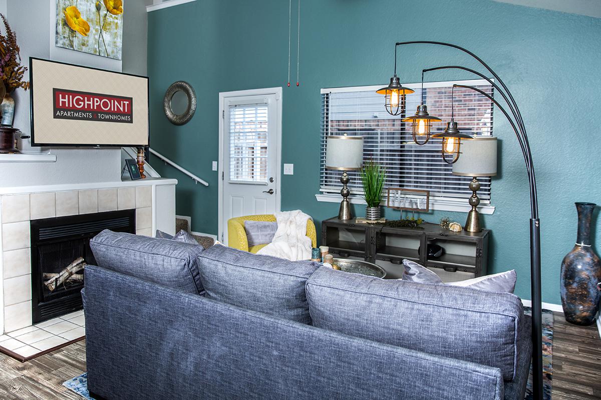 a living room filled with furniture and a tv
