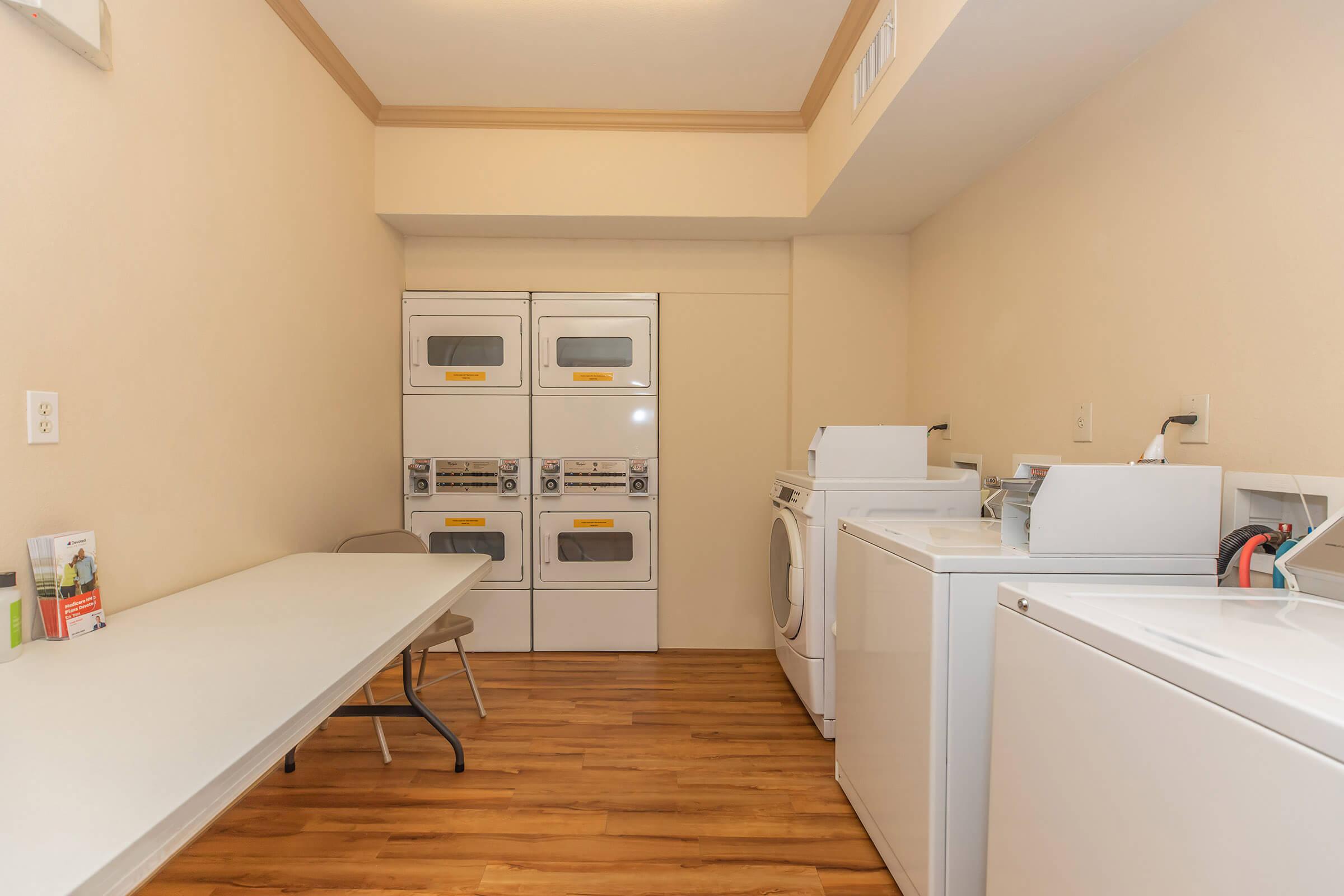 a kitchen with a sink and a refrigerator