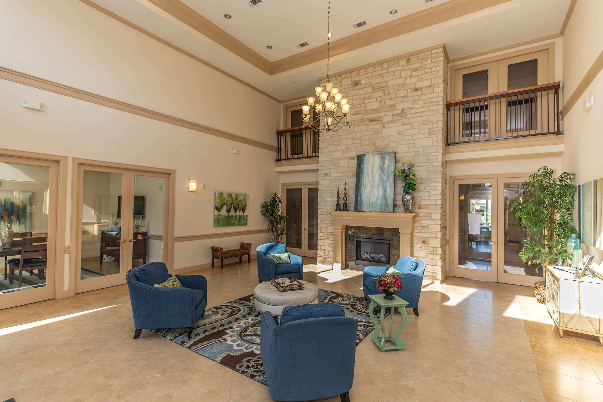 a living room filled with furniture and a fireplace