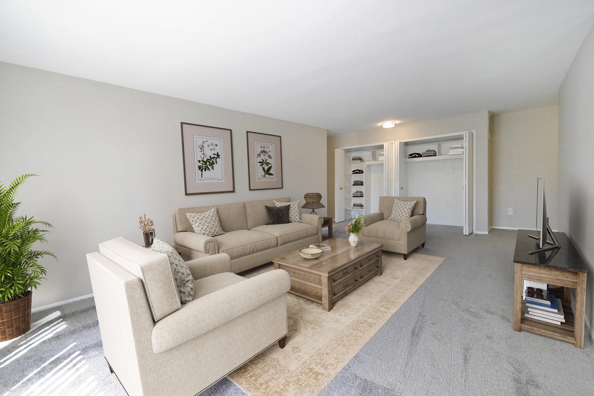 a living room filled with furniture and a flat screen tv