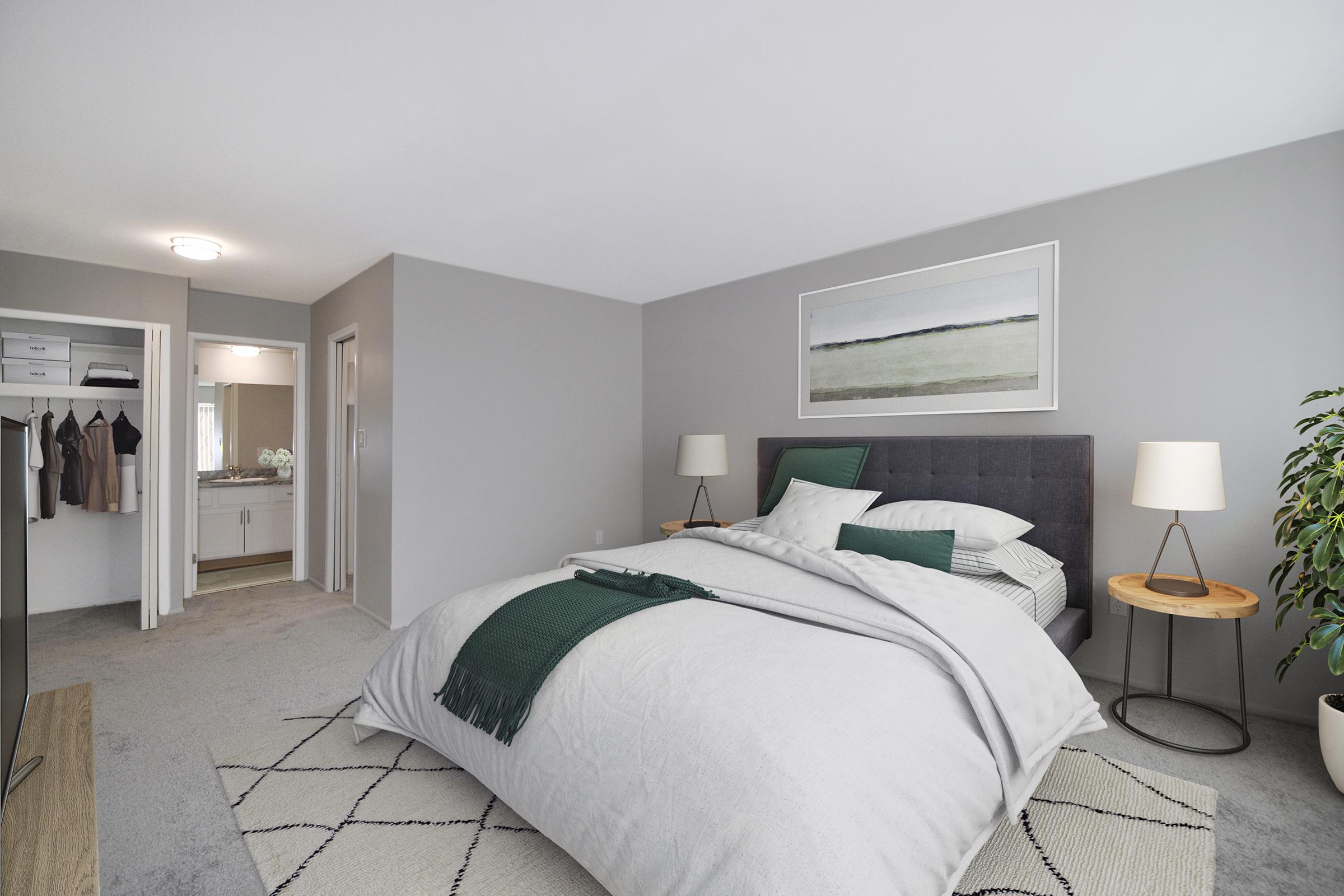 a bedroom with a large bed in a hotel room