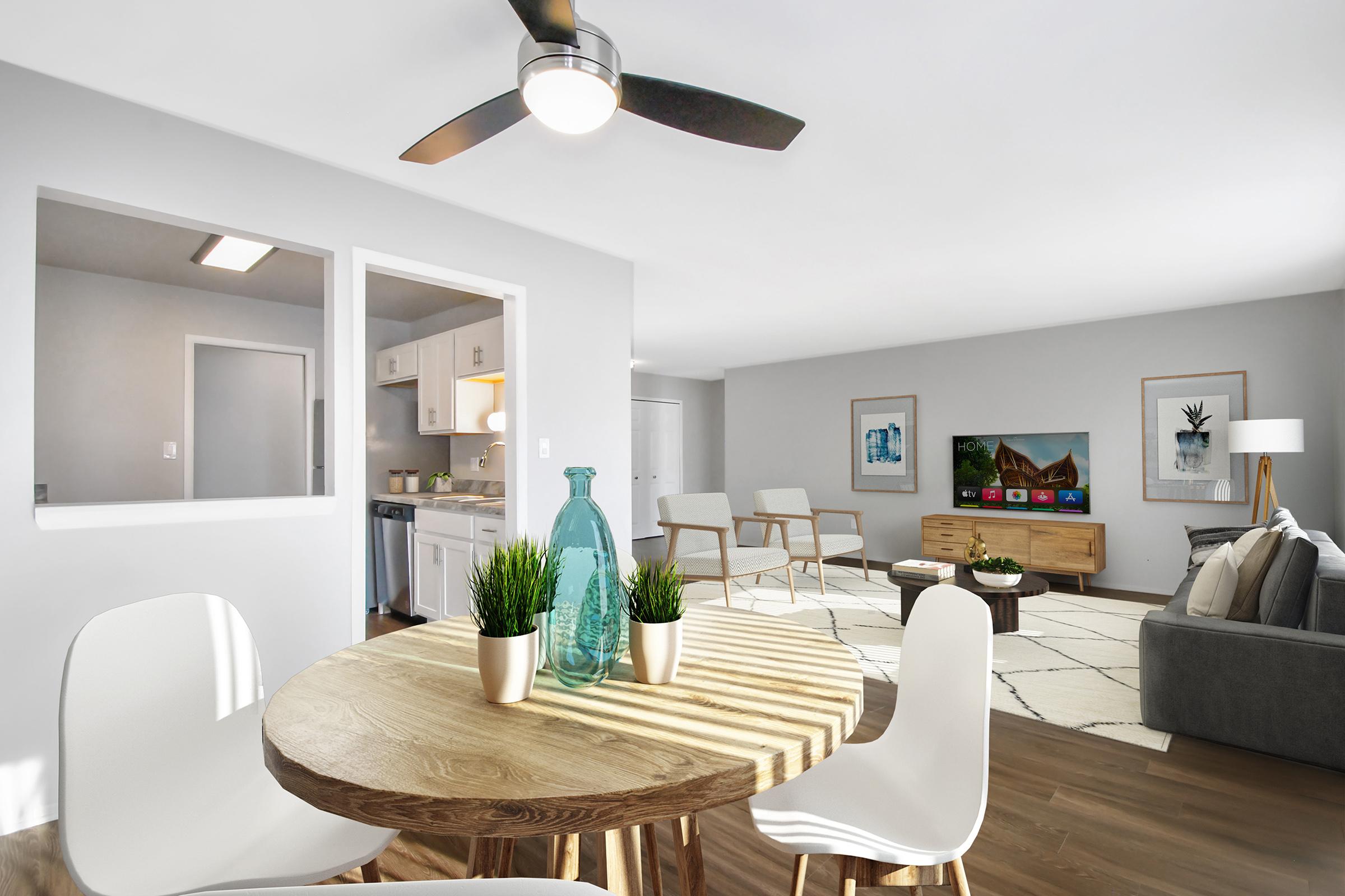 a living room filled with furniture and a flat screen tv