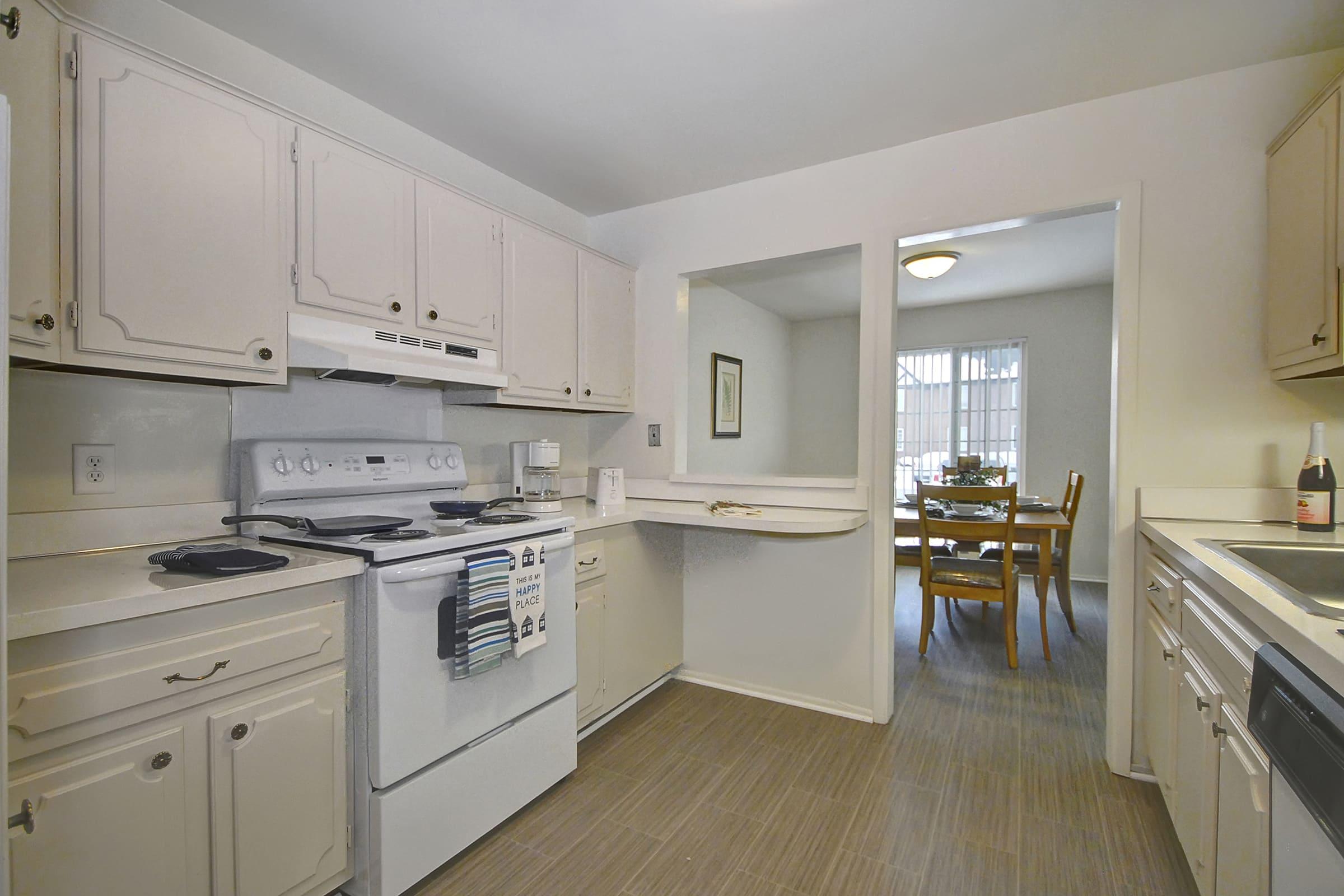 a kitchen with a stove and a refrigerator