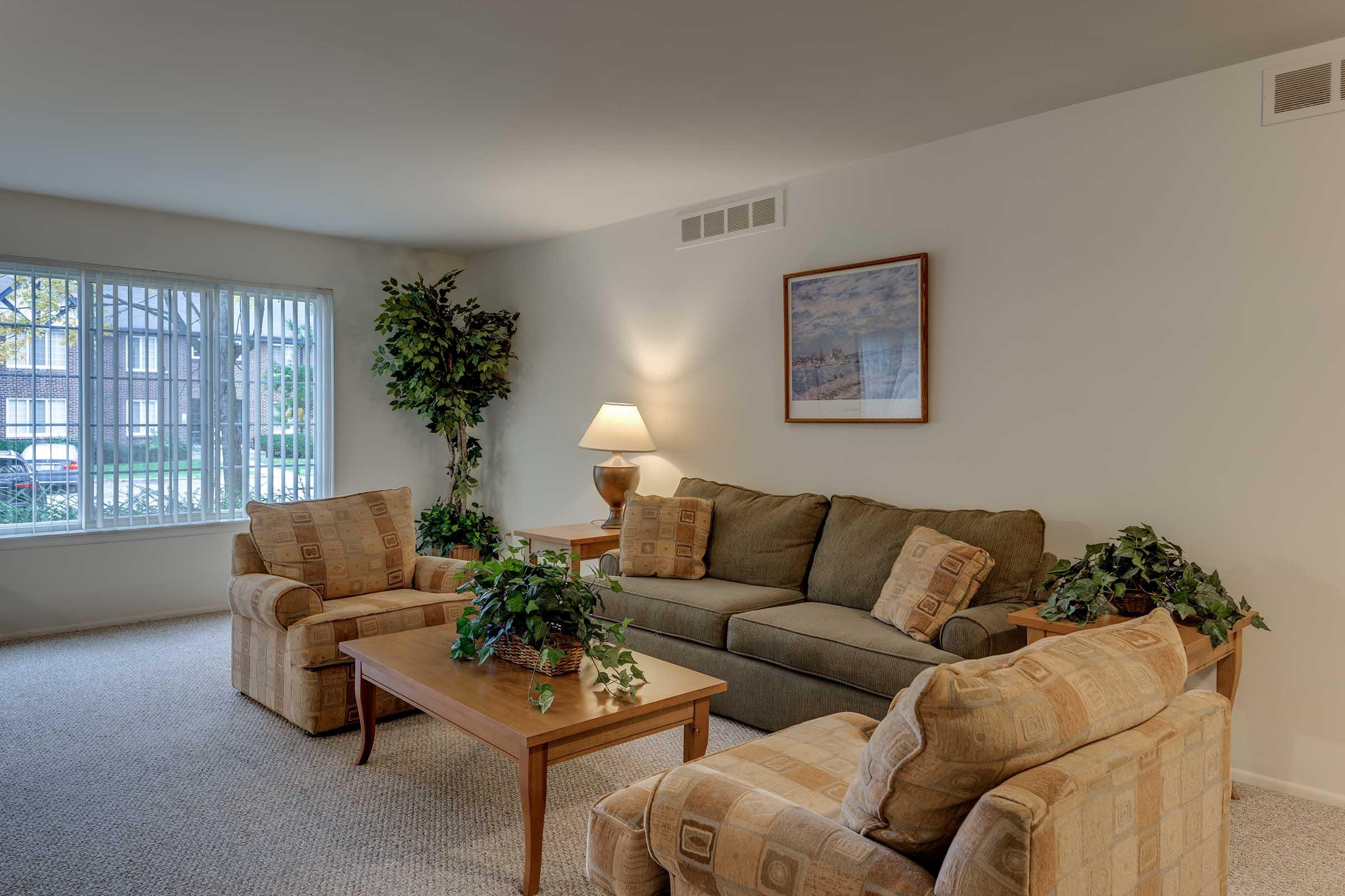 a living room filled with furniture and a flat screen tv