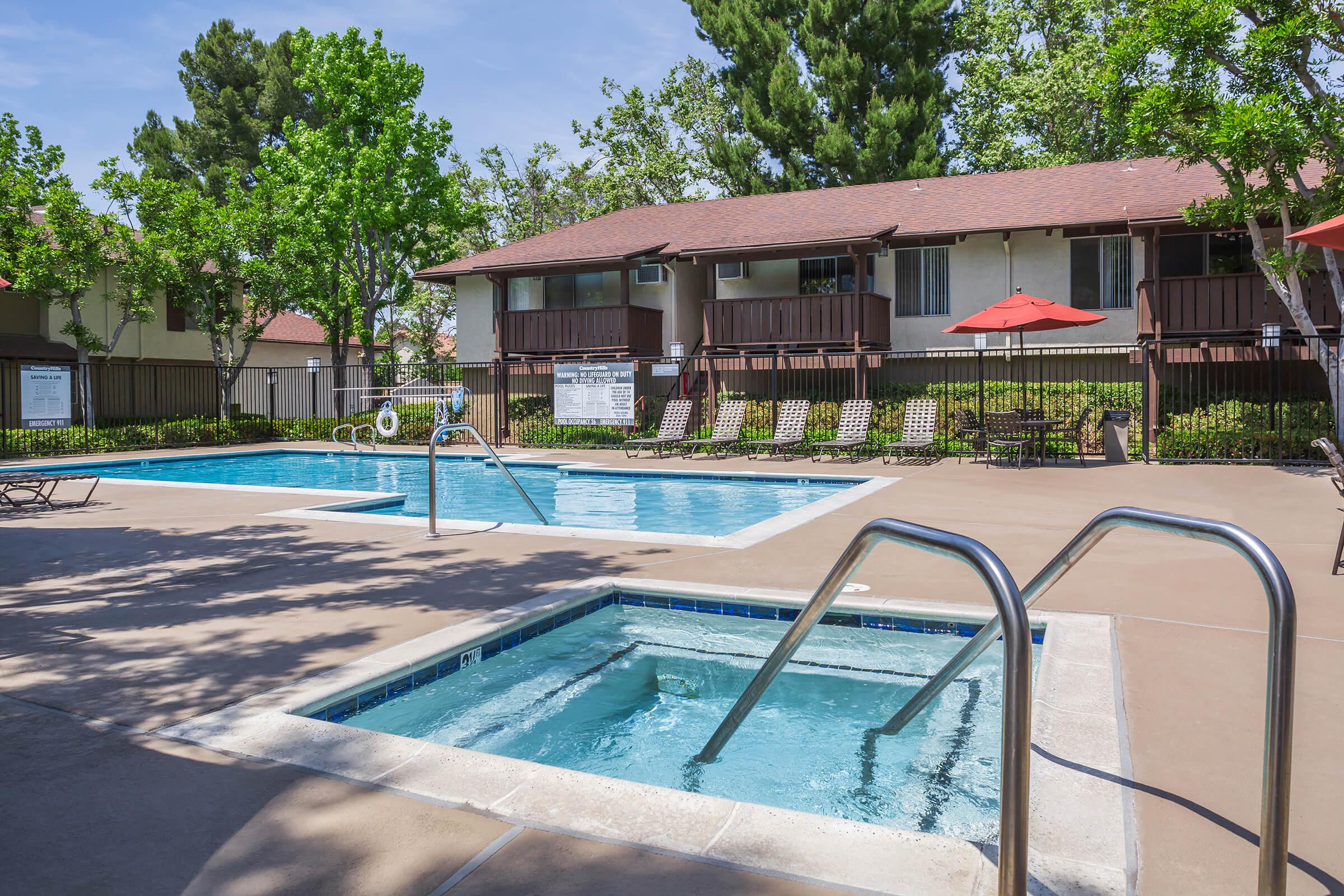 Country Hills Apartment Homes community pool and the community spa