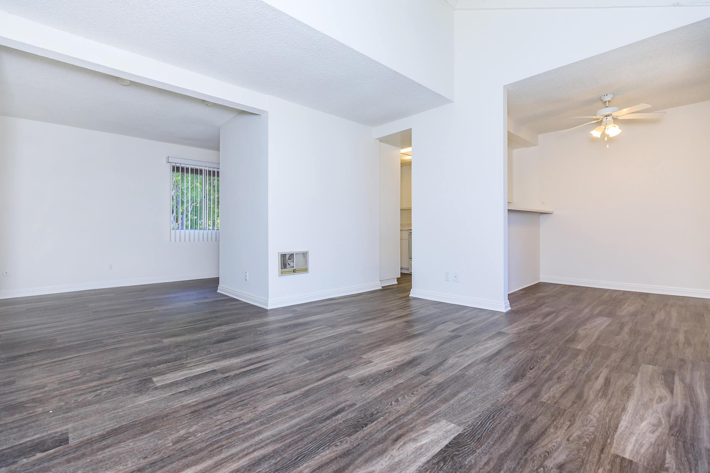 Living room and dining room with wooden floors