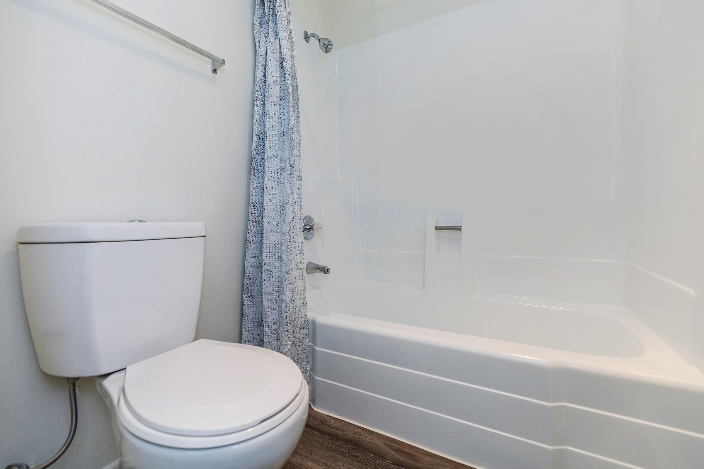 Bathroom with blue shower curtain