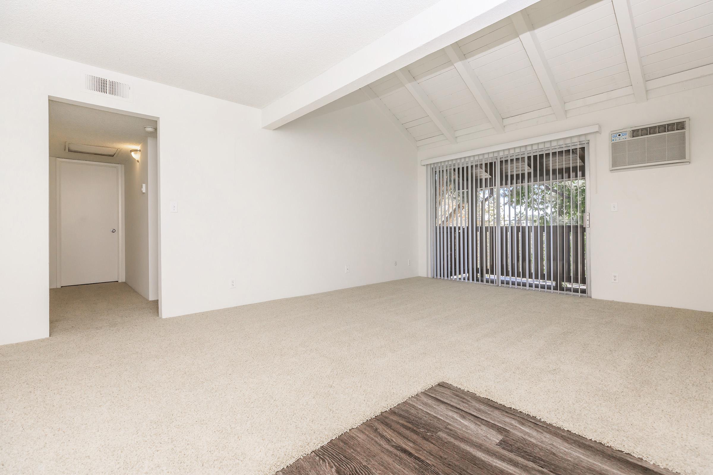 Unfurnished living room with carpet