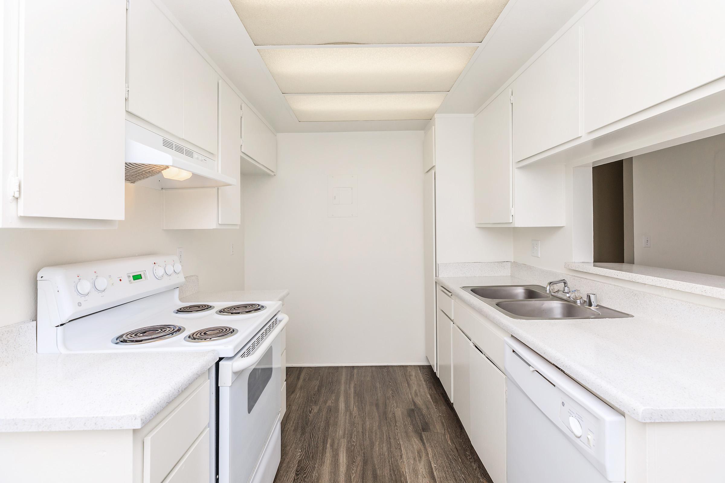 Unfurnished kitchen with wooden floors