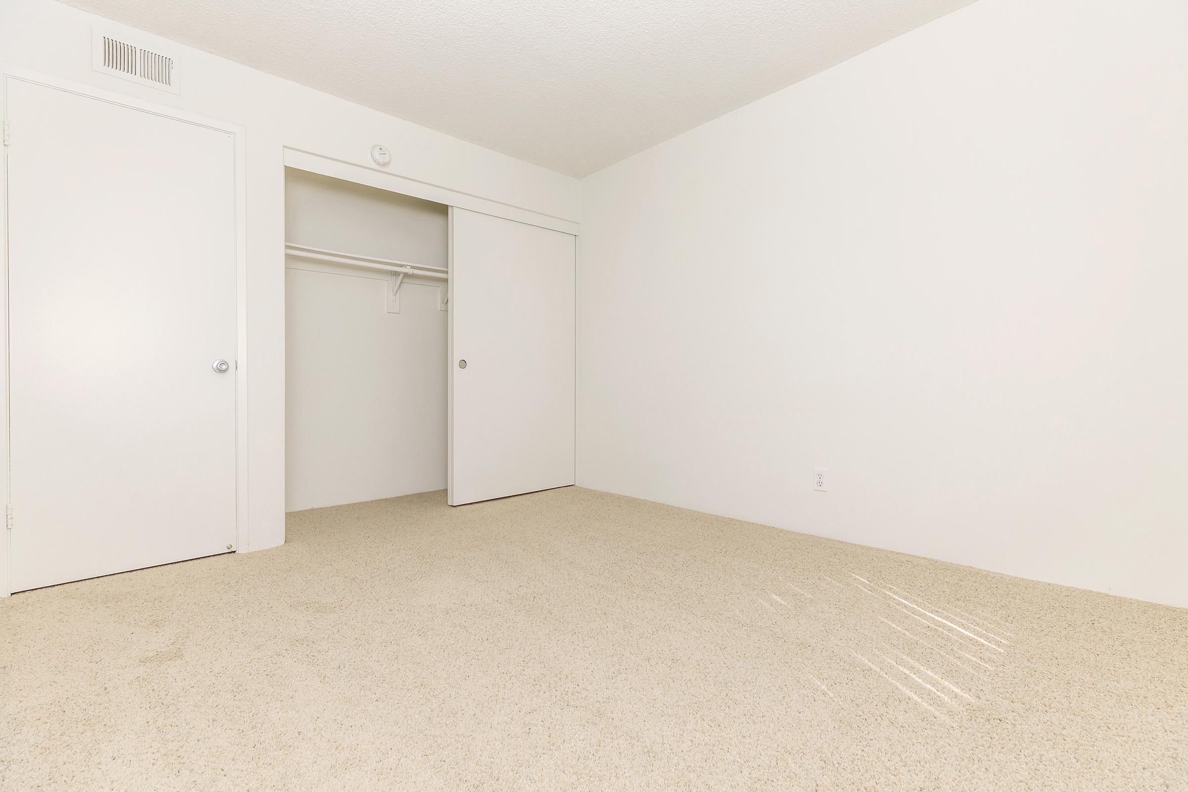 Unfurnished bedroom with carpet