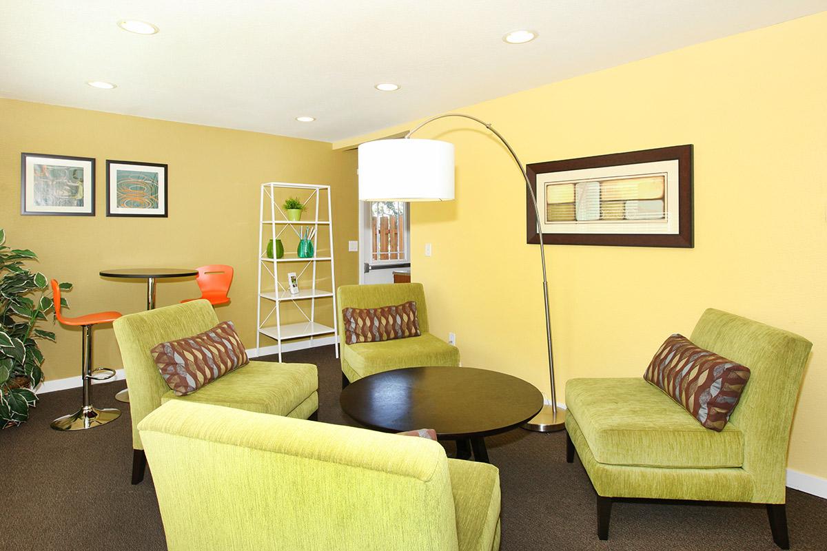 a living room filled with furniture and a flat screen tv