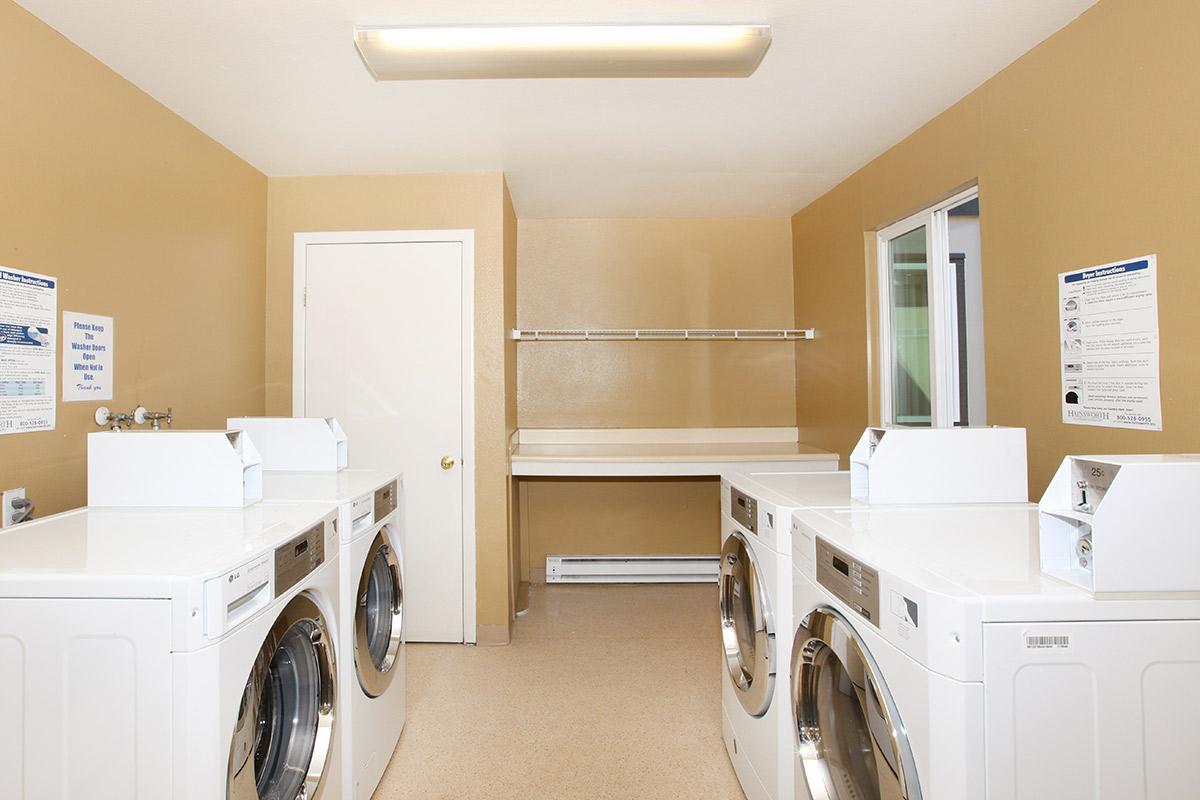 a white refrigerator freezer sitting in a room