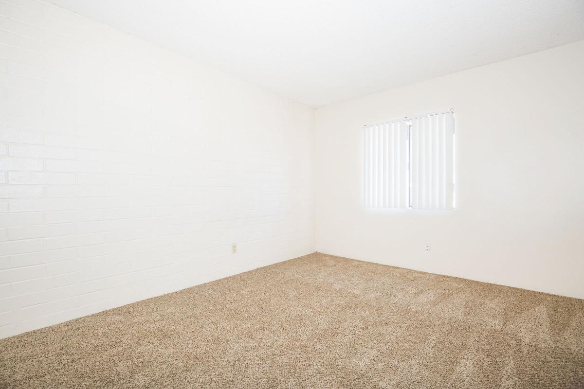 a bedroom with a bed in a room