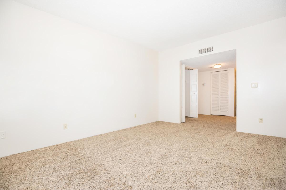 a bedroom with a bed in a room