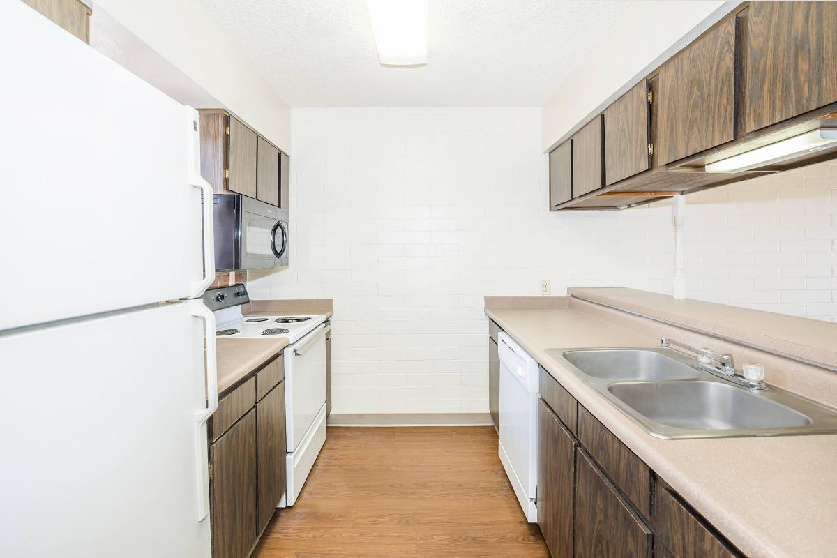 a kitchen with a stove and a sink