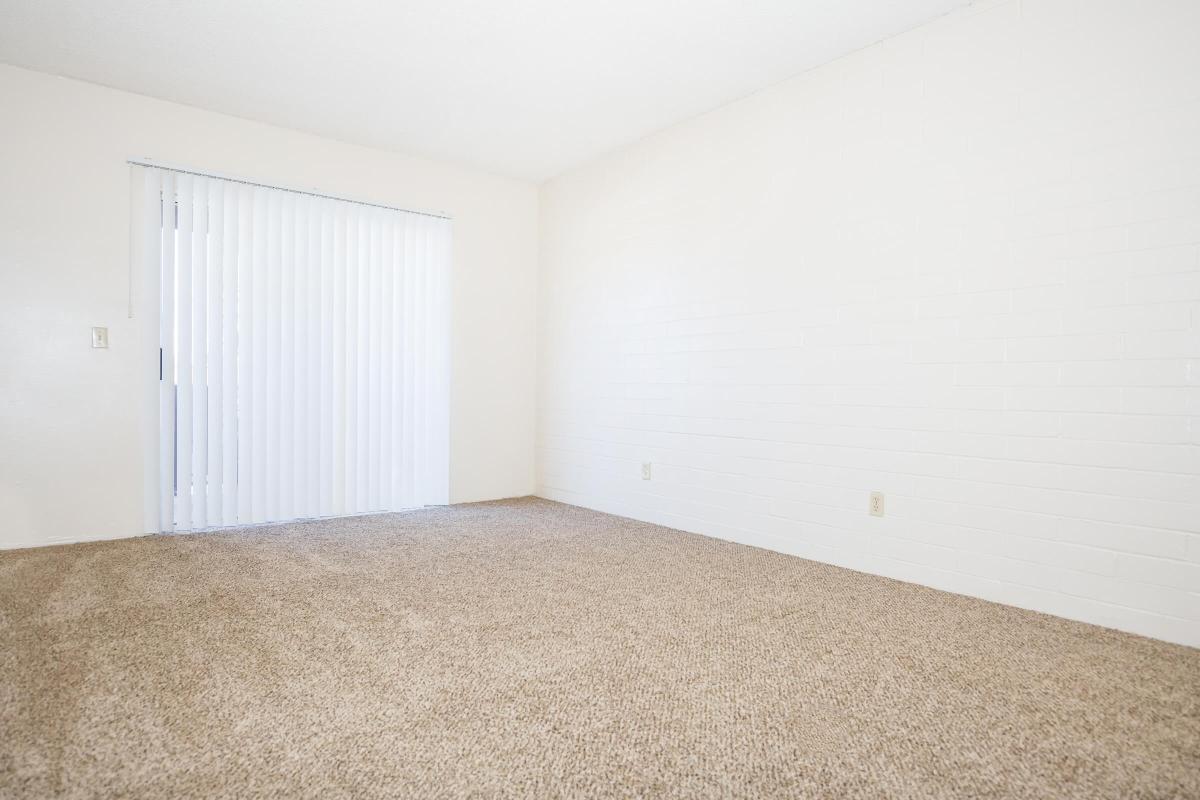 a bedroom with a bed in a room